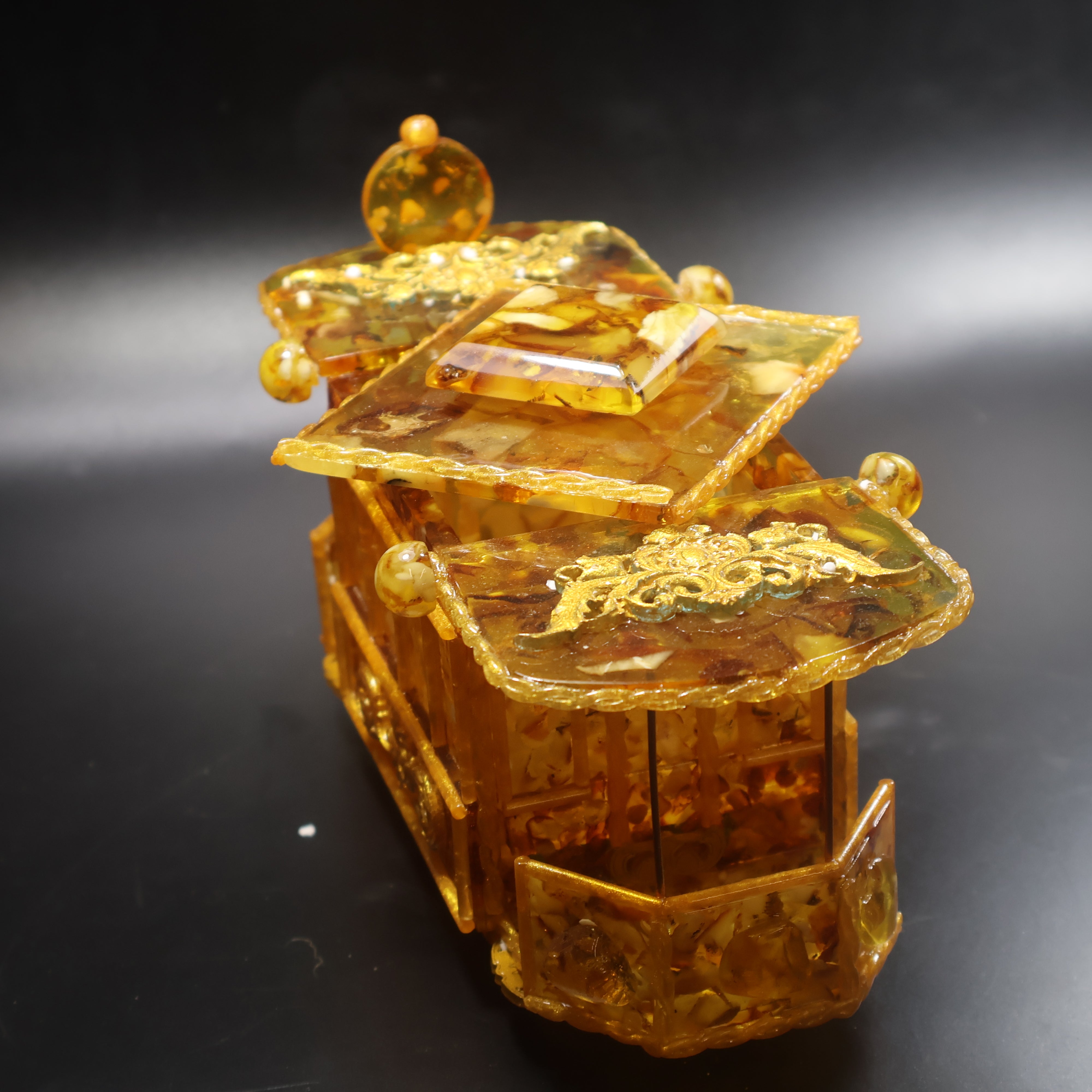 Handcrafted Baltic Amber vintage tram keepsake box angled side view with landscape amber mosaic panels