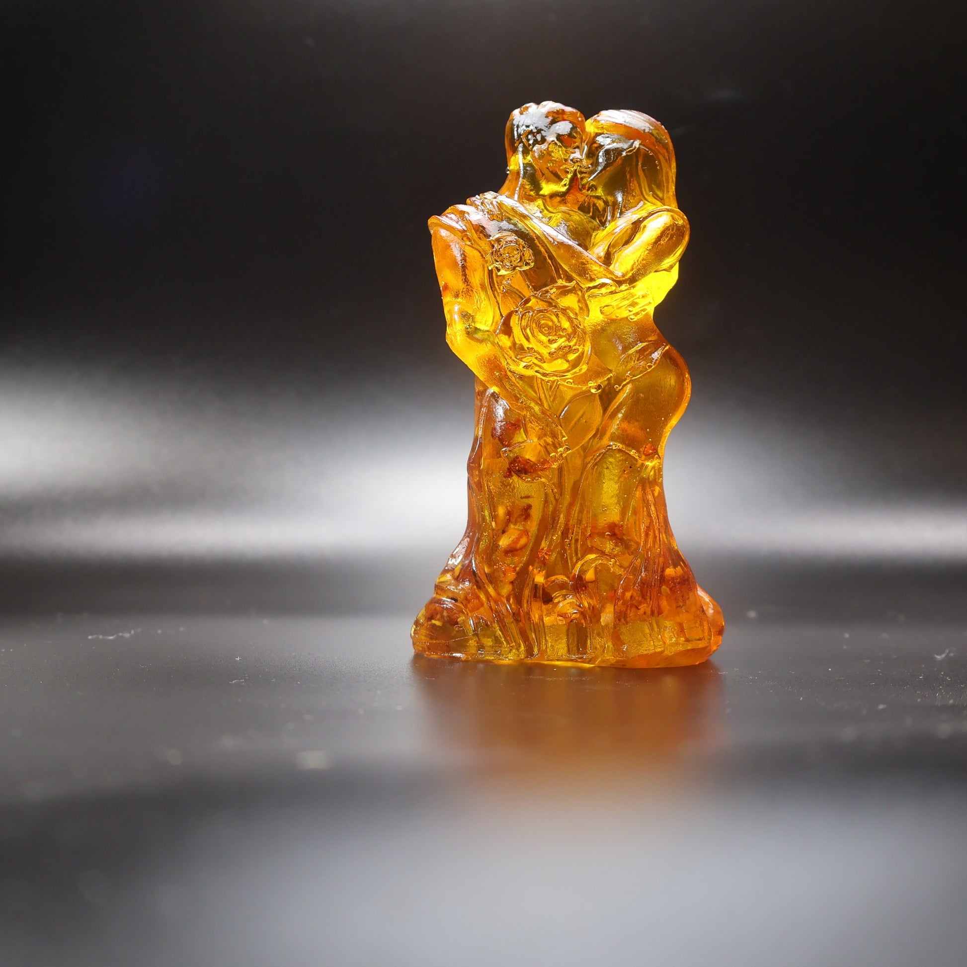 Baltic amber wedding couple figurine as a cake topper, glowing honey-gold sculpture, made in USA