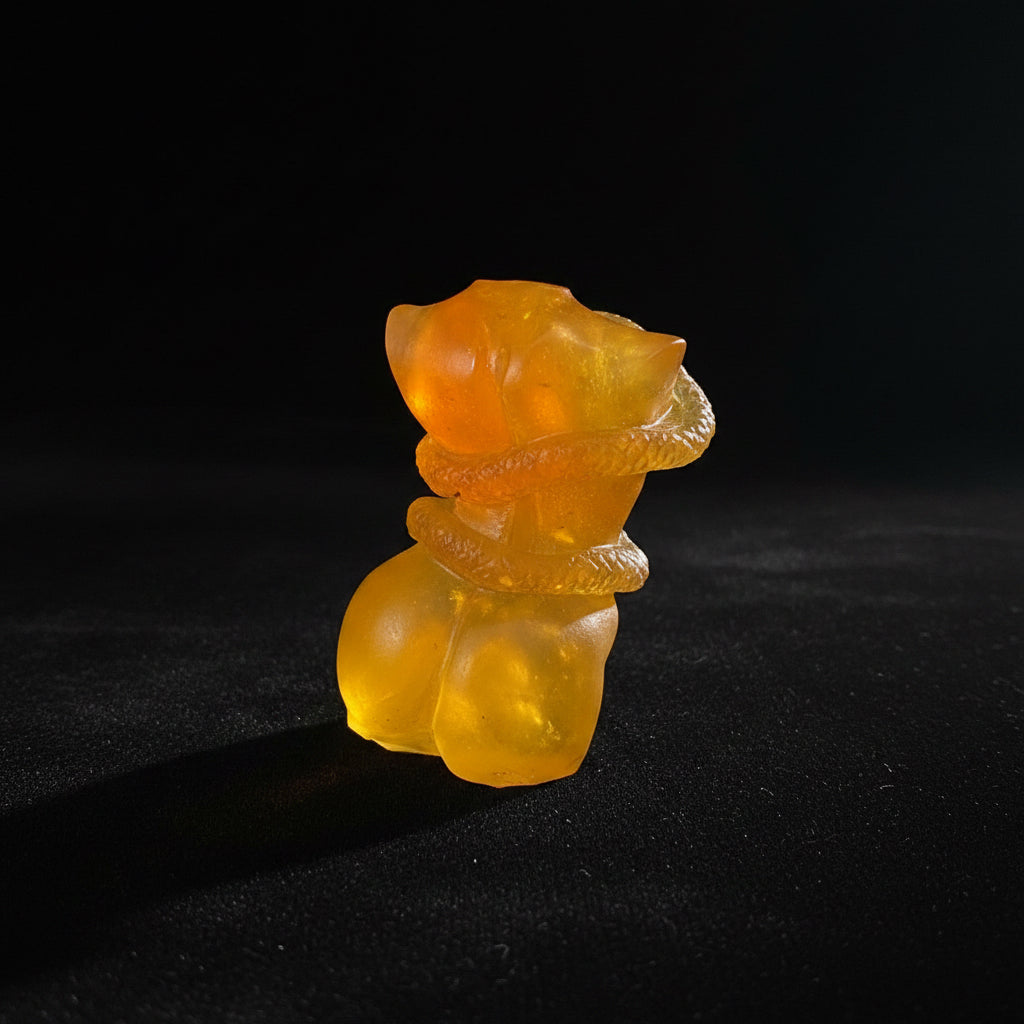 KIZIMA® amber woman and snake figurine — genuine Baltic amber decor, handmade in USA, angled view