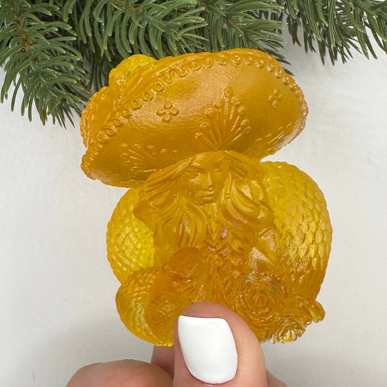 Handmade Baltic amber woman with snake by KIZIMA® USA — natural amber decor, side view