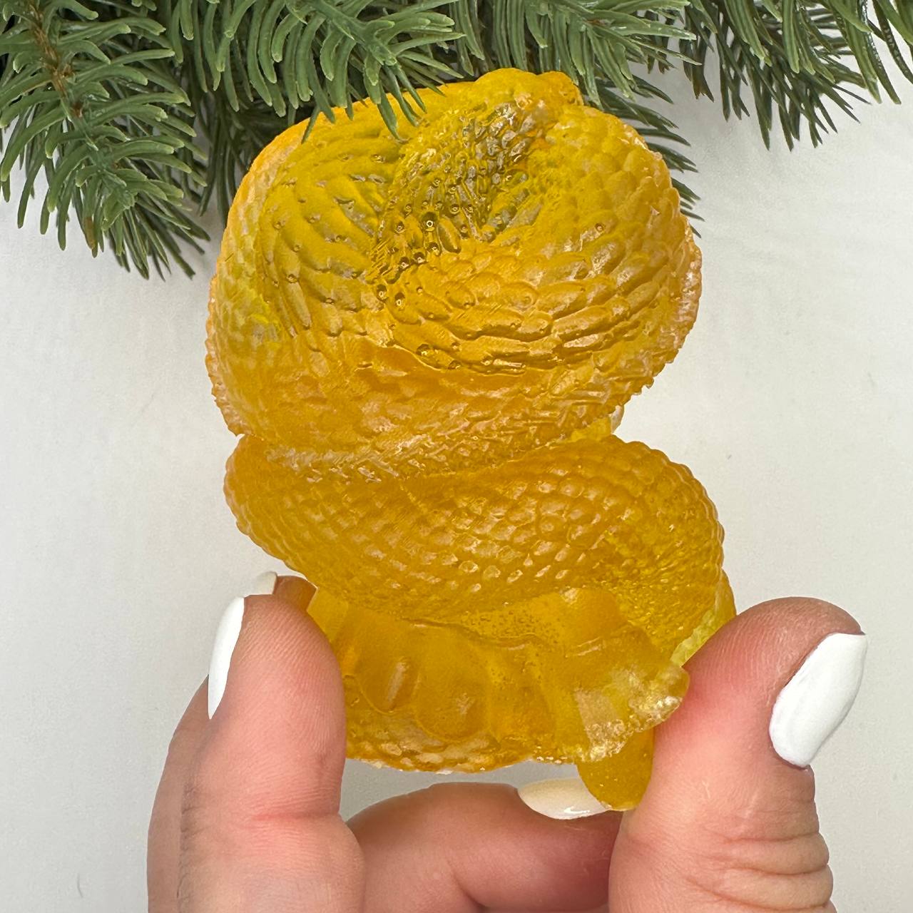KIZIMA® amber woman with snake figurine — genuine Baltic amber decor, handmade in USA, angled view
