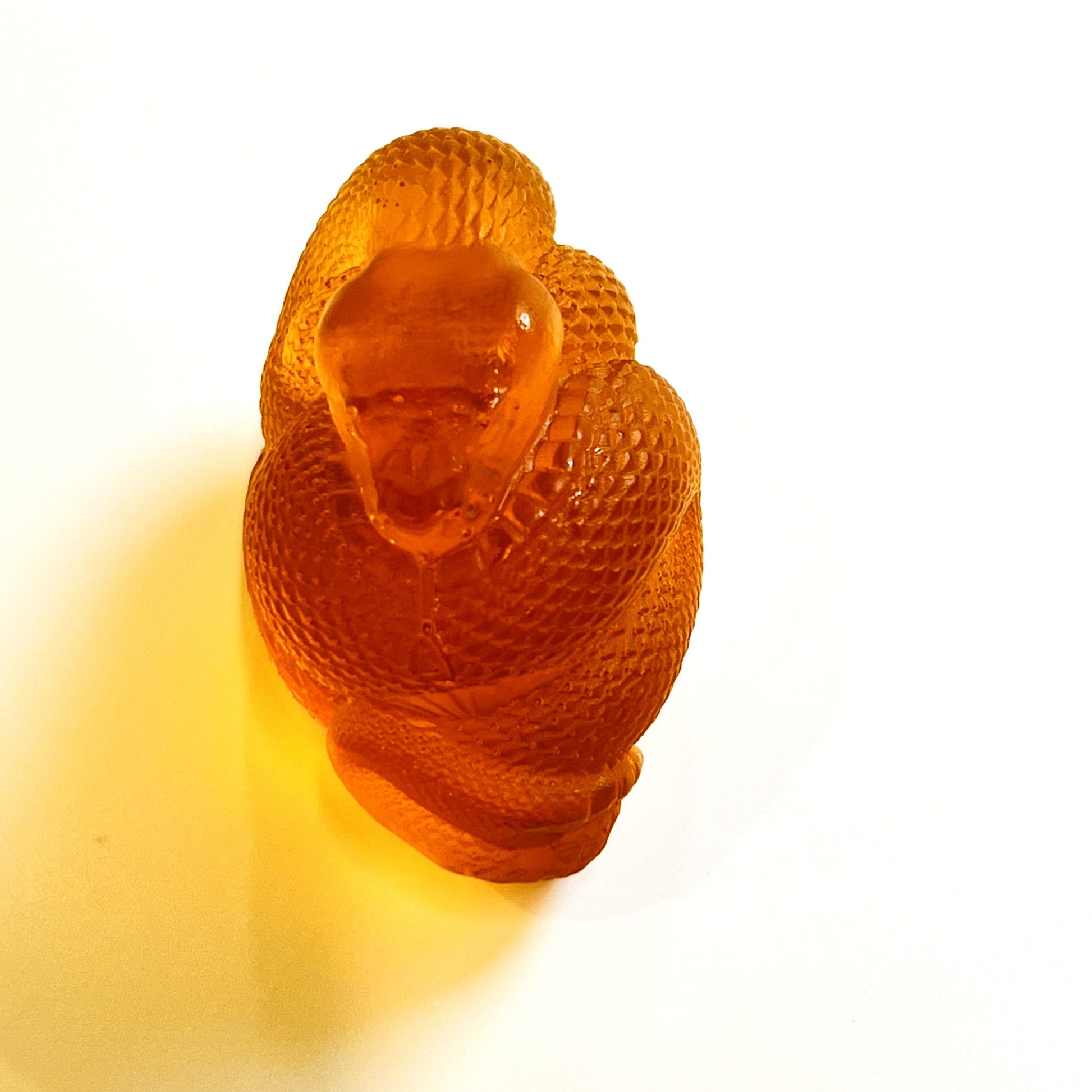 Handmade Baltic amber zodiac snake by KIZIMA® USA — natural amber decor, side view