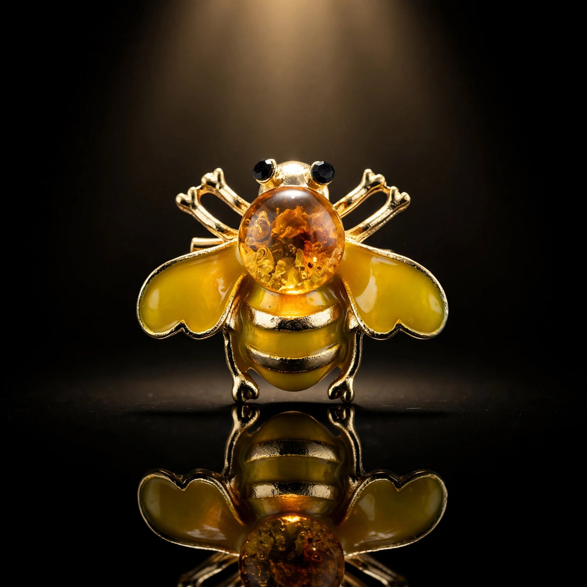 Handmade Baltic amber bee brooch, luxury studio photo on black background — KIZIMA, Made in USA