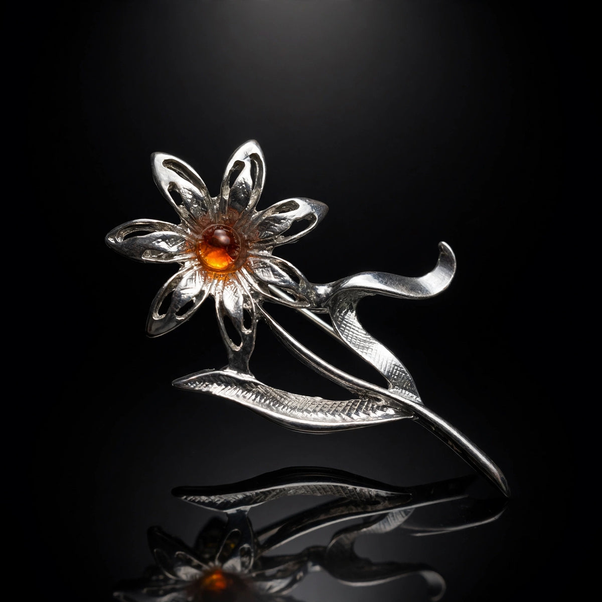 Handmade Baltic amber daisy brooch, luxury studio photo on black background — KIZIMA, Made in USA