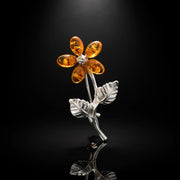 Handmade Baltic amber flower brooch, luxury studio photo on black background — KIZIMA, Made in USA