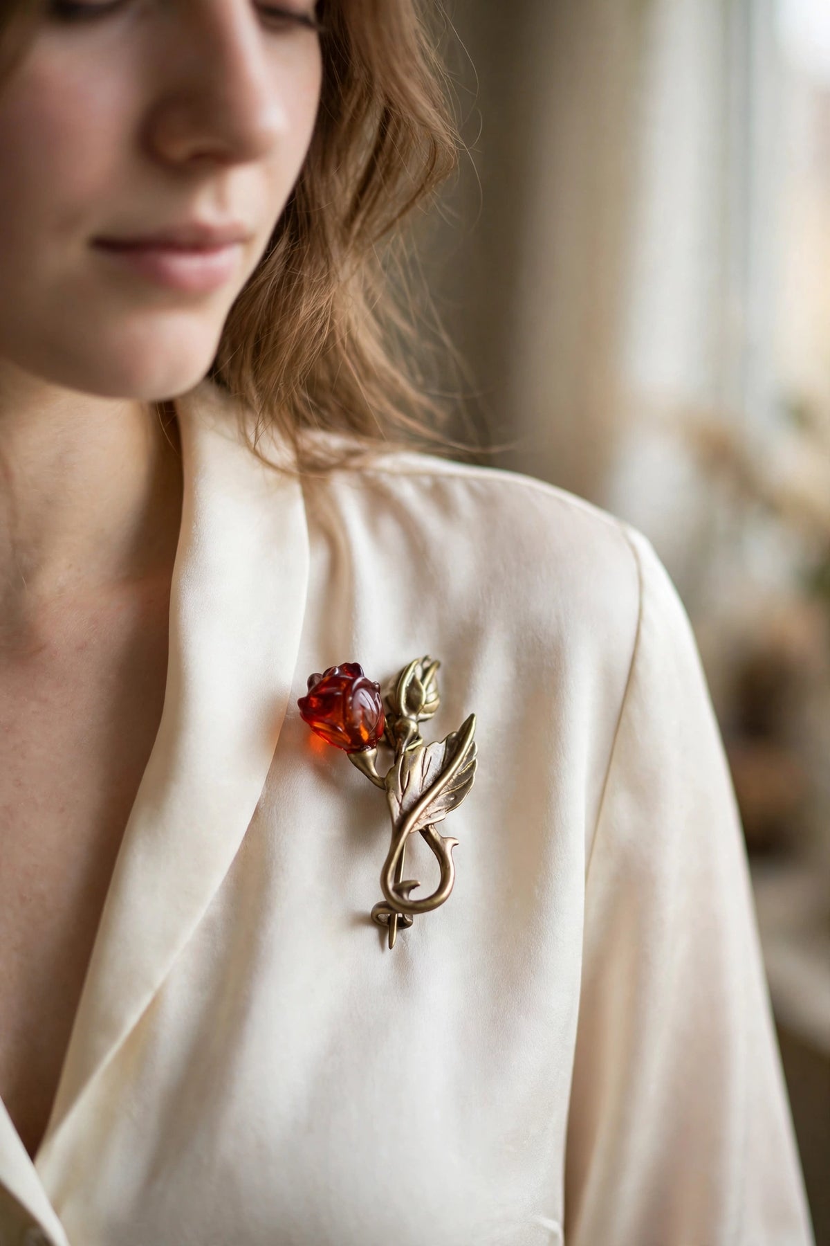 Handmade Baltic amber flower & bud brooch worn on a model — KIZIMA, Made in USA