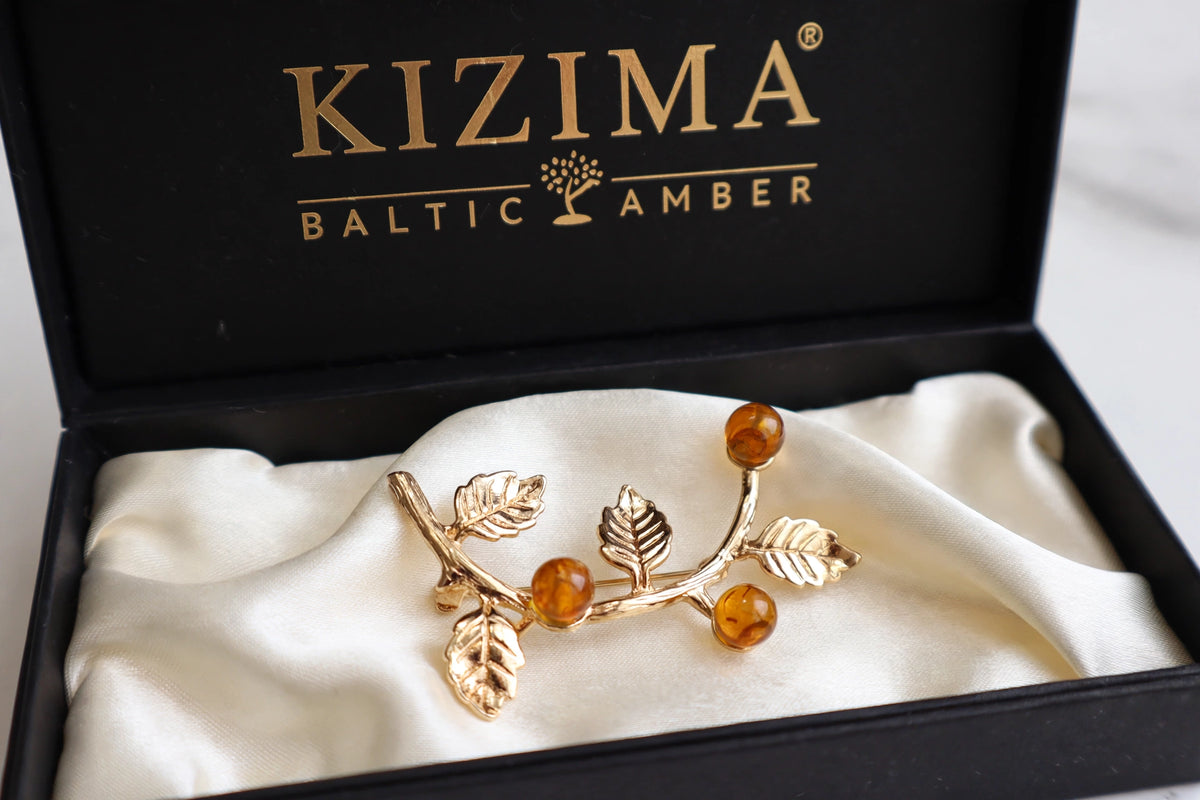 Handmade Baltic amber honey brooch in black KIZIMA gift box — Made in USA