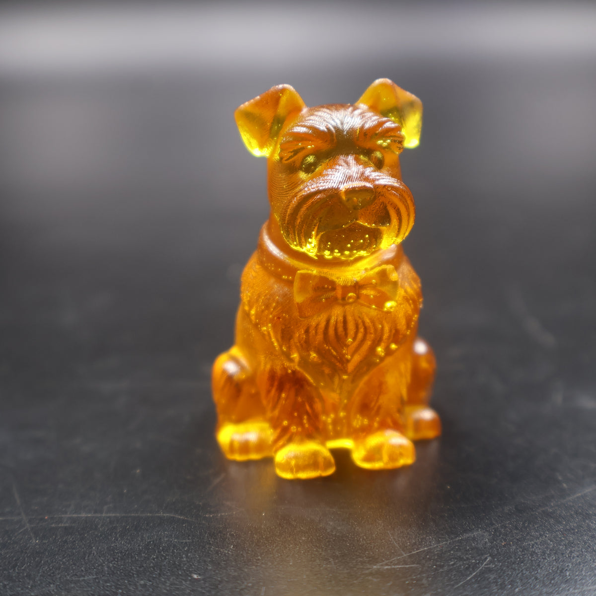 Golden Baltic amber Schnauzer figurine with bow collar, handmade in Brooklyn New York