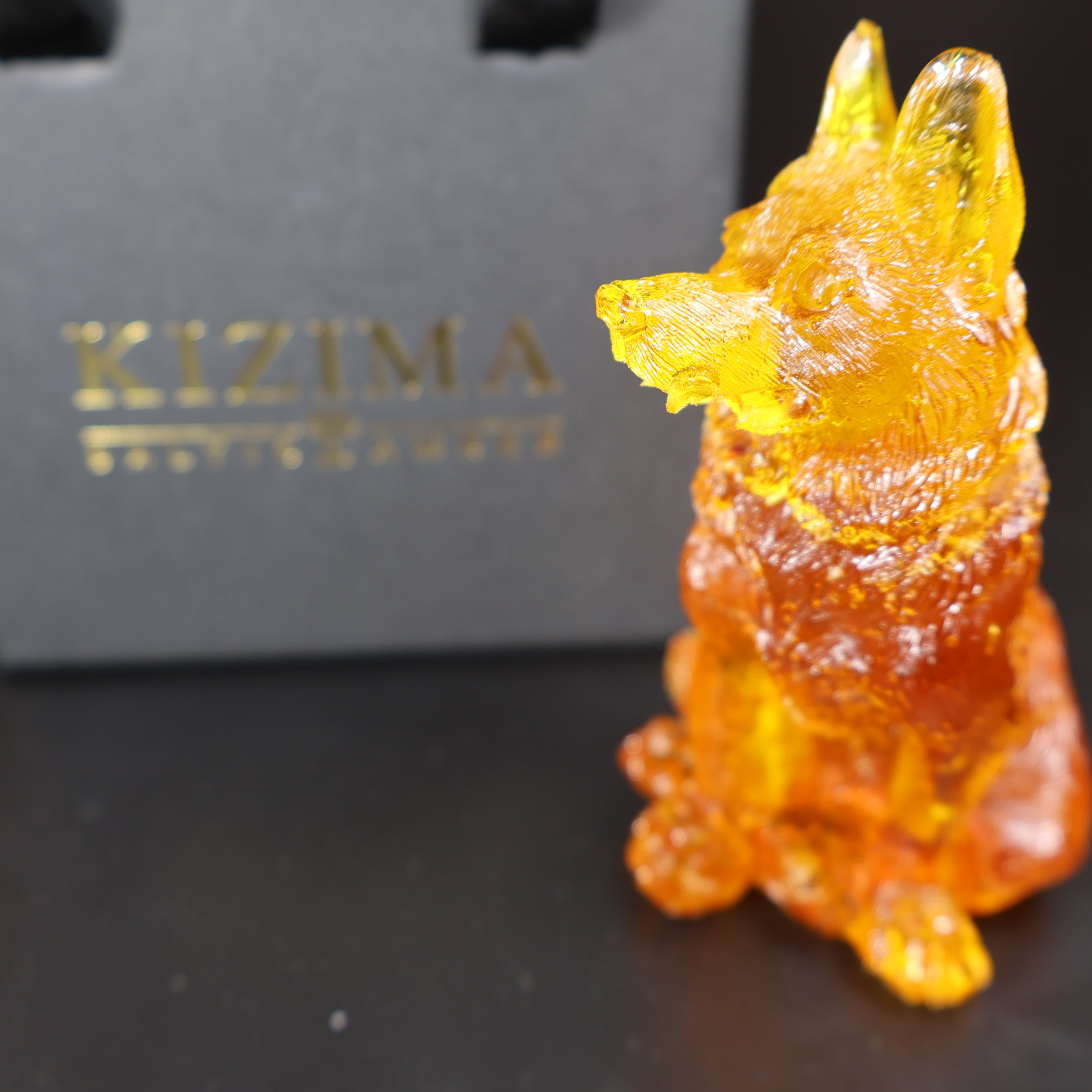 Natural Baltic amber wolf figurine detail view KIZIMA handcrafted