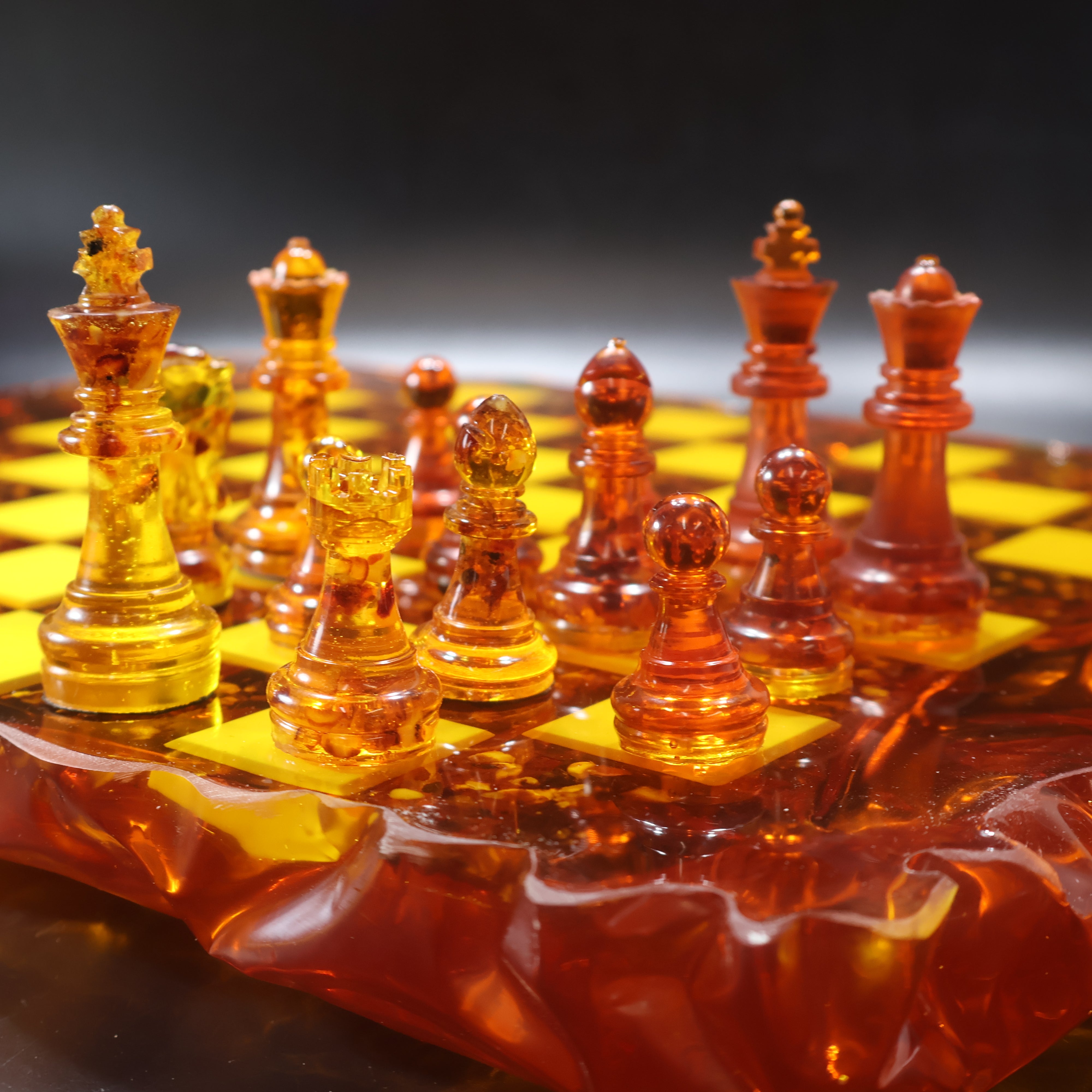 Handcrafted Baltic amber chess set detail, ice-like carved amber board edges, made in USA