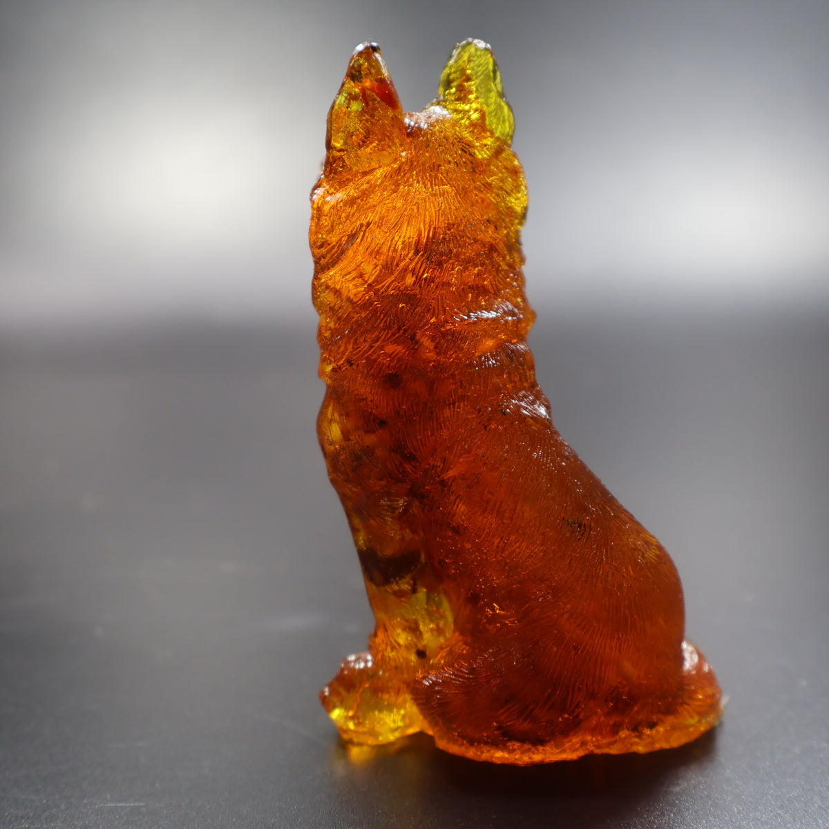 Amber German Shepherd figurine three-quarter view showing raised ears, American amber decor