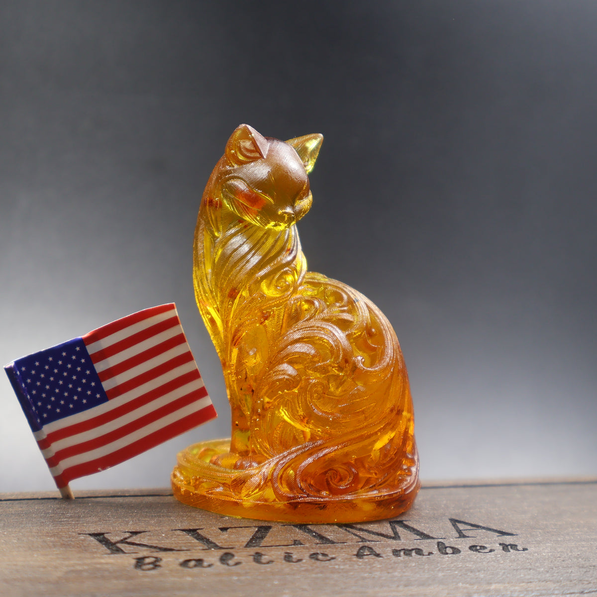 Baltic amber cat figurine with American flag on KIZIMA display, Made in USA amber gift