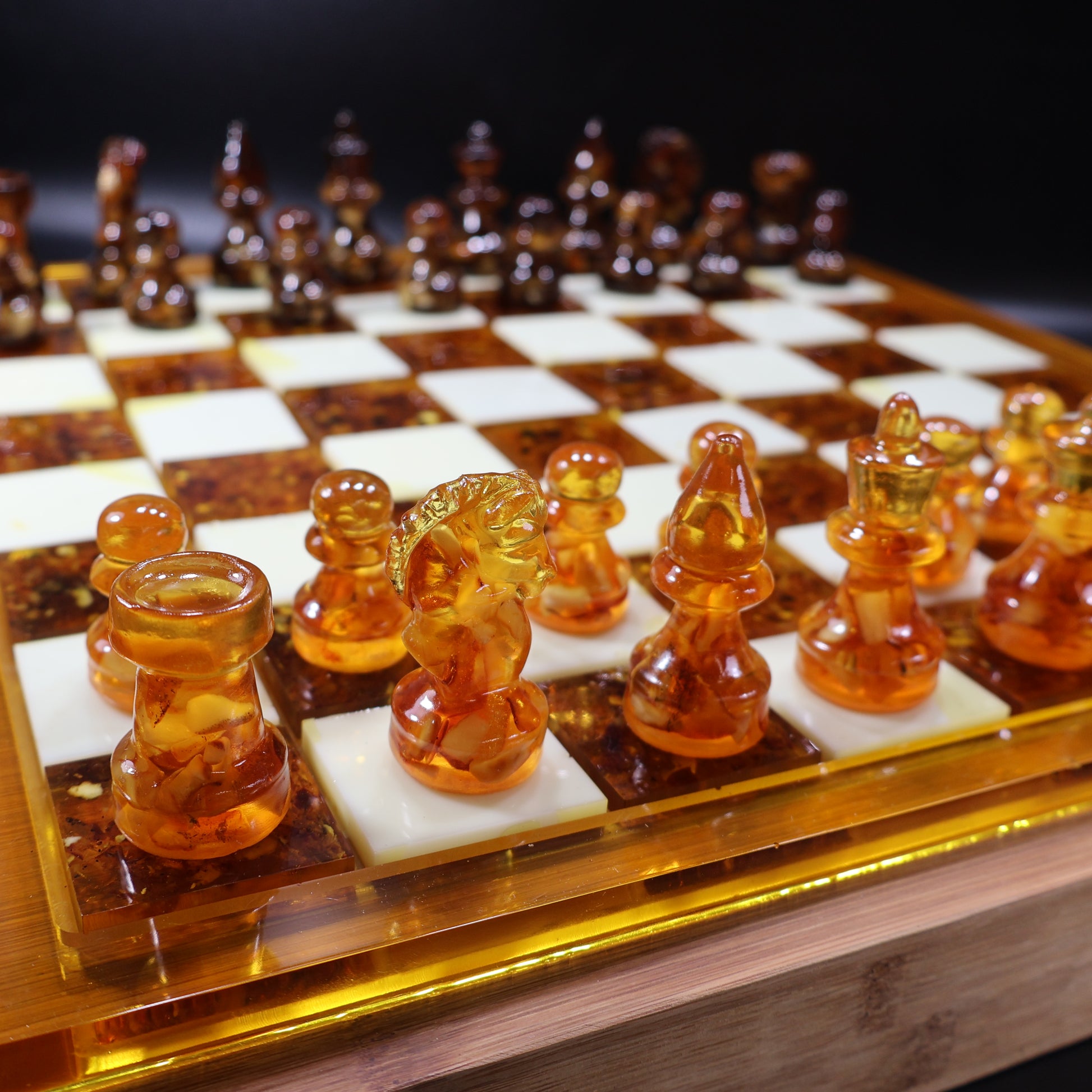 Cognac amber chess pieces on wooden amber-inlay chessboard, handcrafted Brooklyn