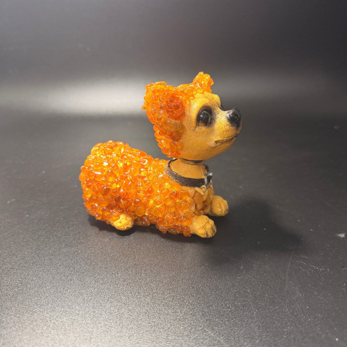 Made in USA natural Baltic amber bobblehead dog figurine, light honey amber puppy with studded collar, side view — KIZIMA® Brooklyn NY