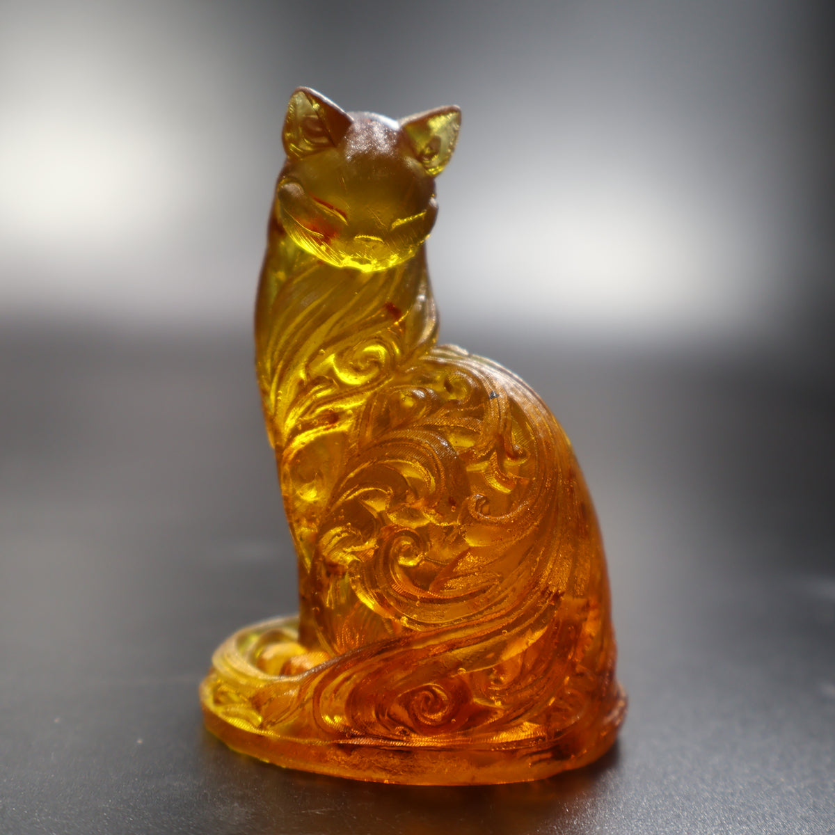 Natural Baltic amber ornamental cat figurine on oval base handcrafted in USA by KIZIMA