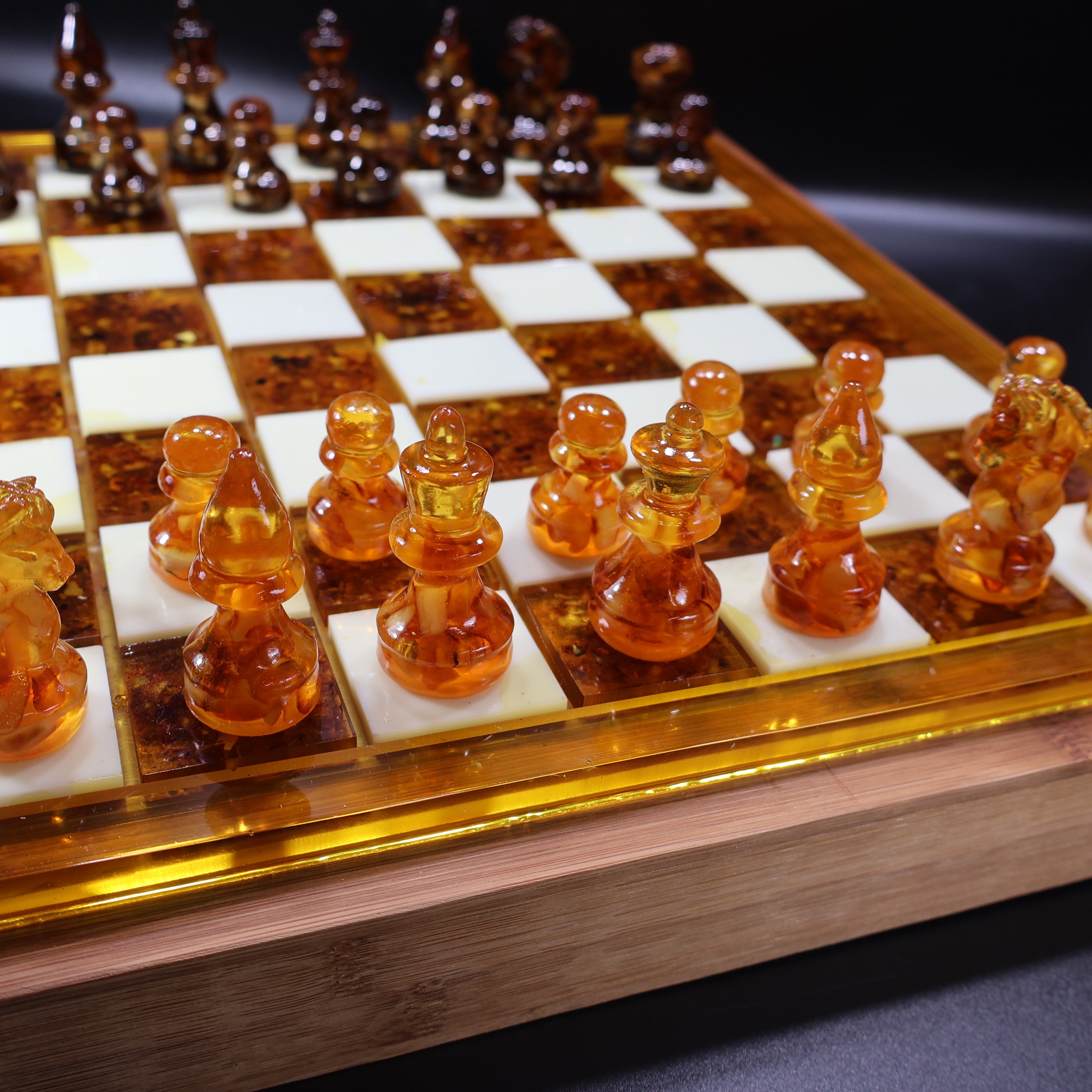 Full view of natural Baltic amber chess set on wooden board, KIZIMA®
