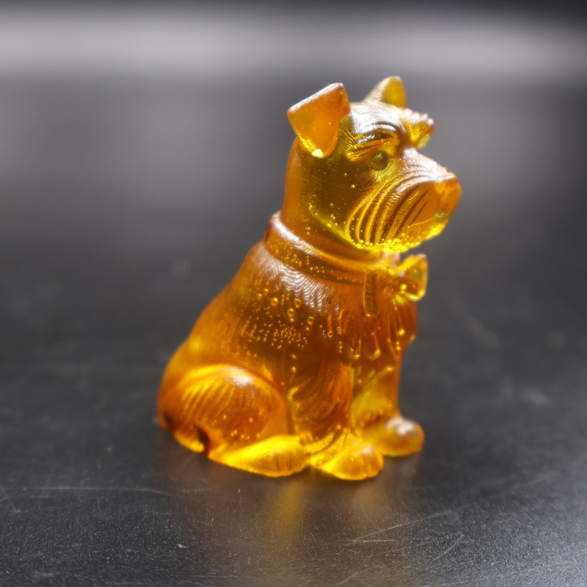 Natural Baltic amber Schnauzer dog figurine handcrafted in USA by KIZIMA, side view
