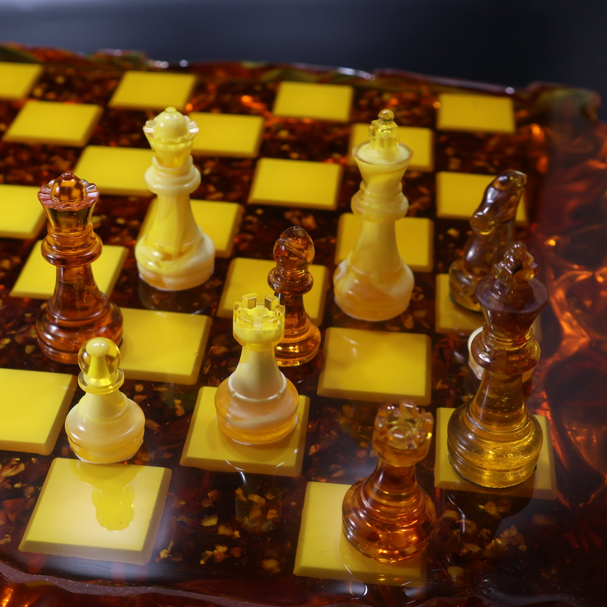 Cognac amber chessmen close-up, translucent handmade chess pieces by KIZIMA Brooklyn