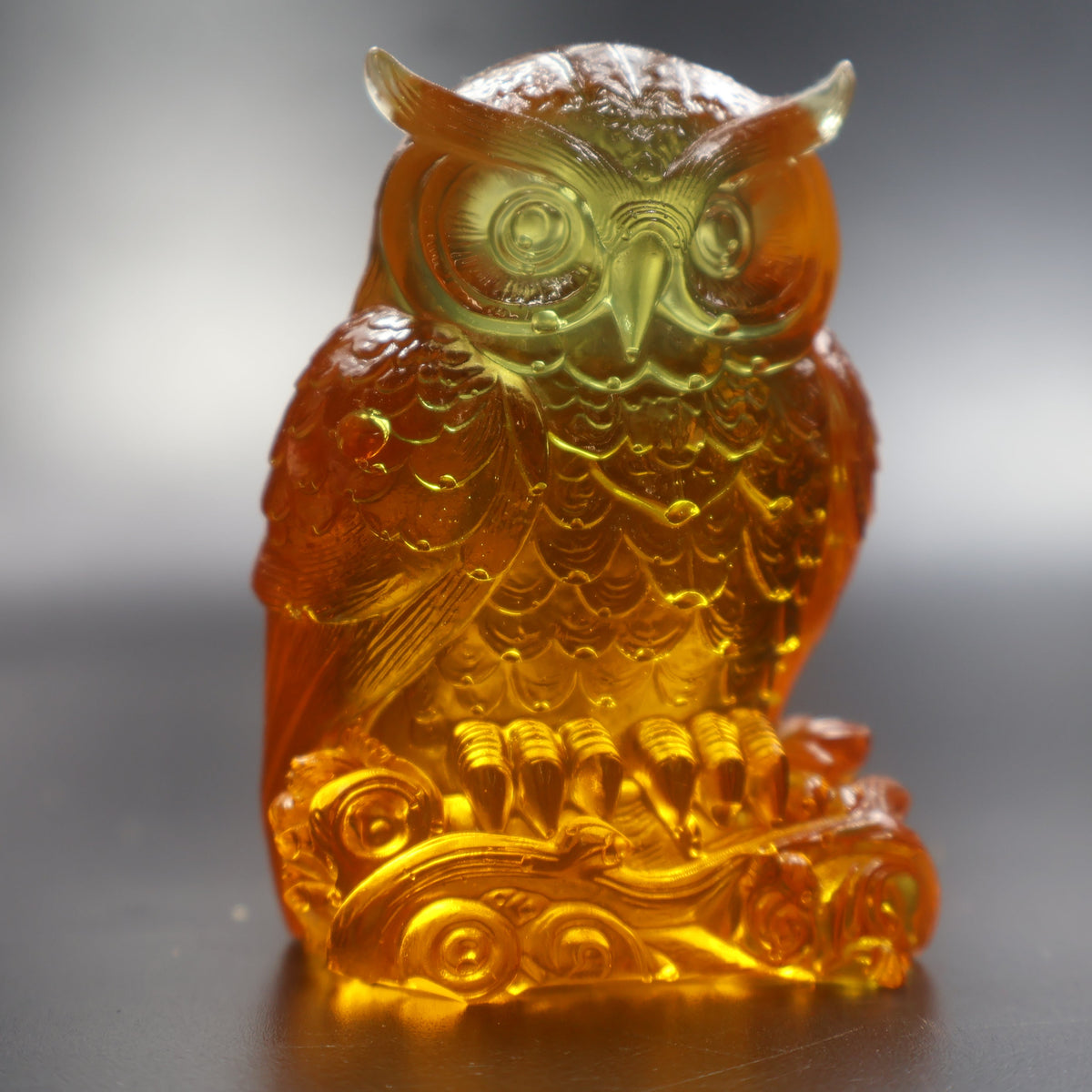 Handcrafted Baltic amber owl figurine side view, collectible amber art by KIZIMA