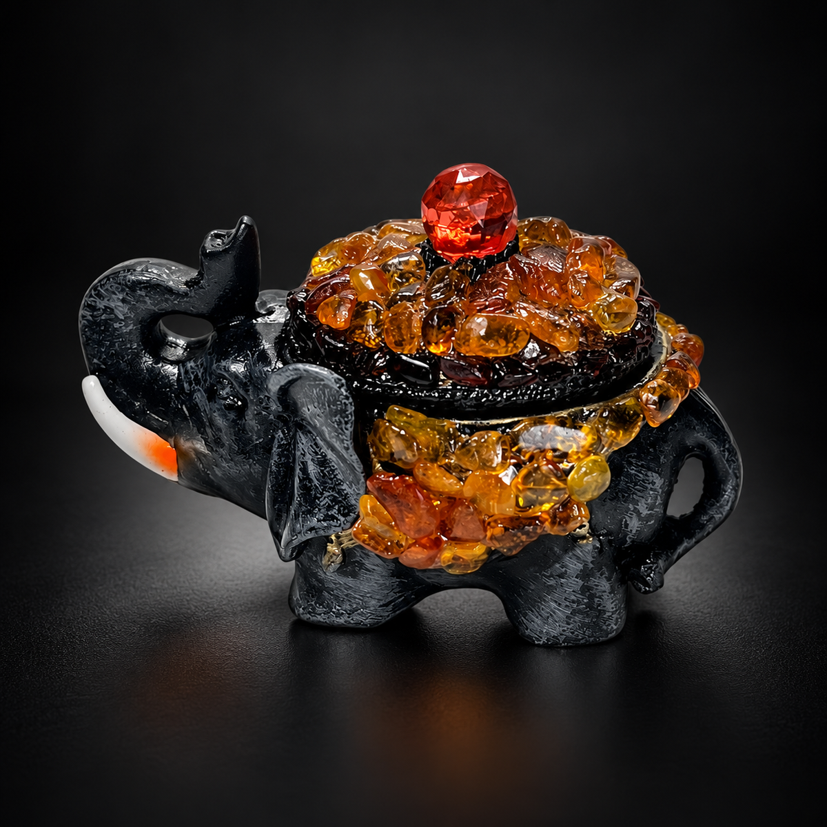 KIZIMA Baltic amber elephant jewelry box on a black studio background
