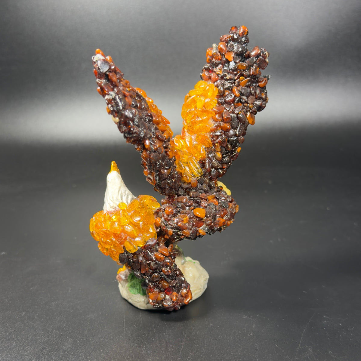 Original rear photograph of KIZIMA Baltic amber two-eagle sculpture with raised wings, SKU 18-02Q200-3-5-6.