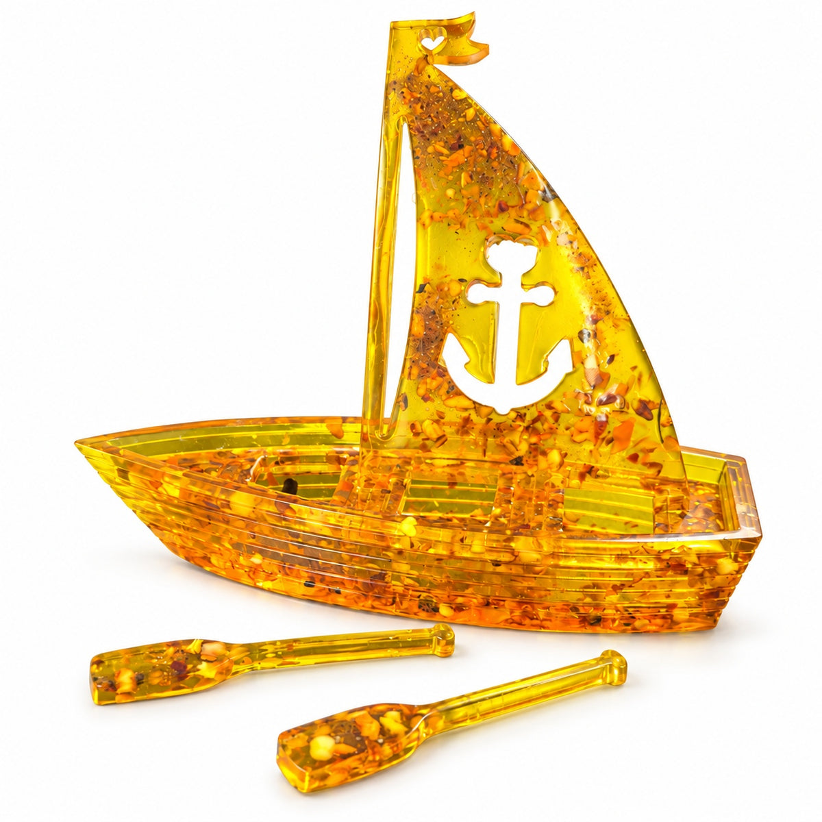 Honey-gold Baltic amber boat, anchor sail design, shown with matching oars on a clean white background.
