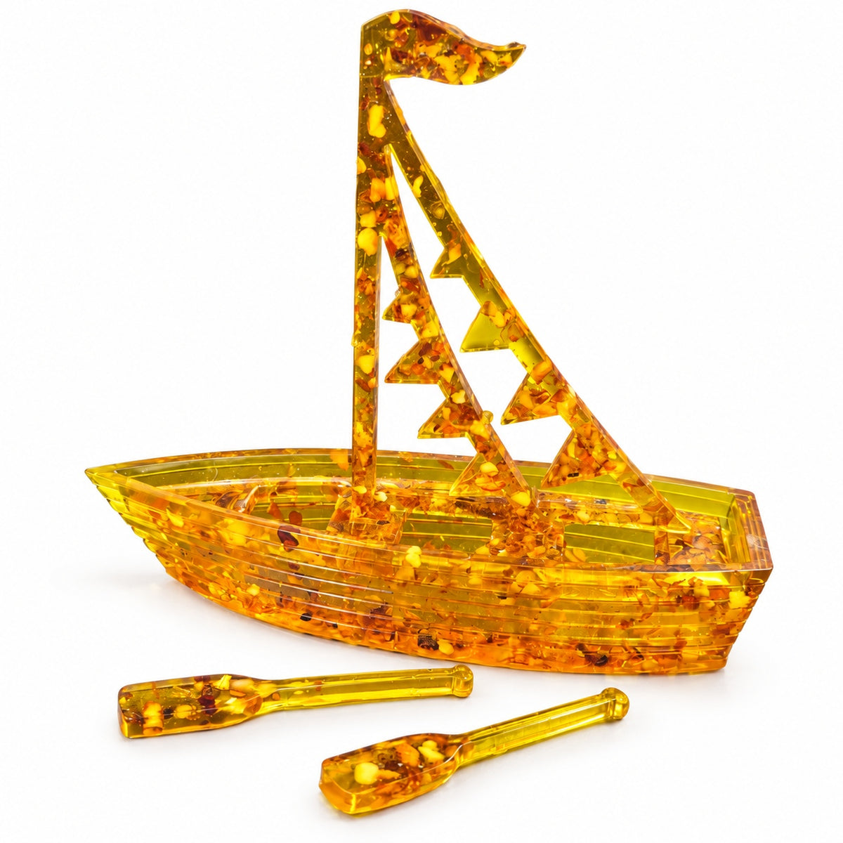 Honey-gold Baltic amber boat, flags sail design, shown with matching oars on a clean white background.