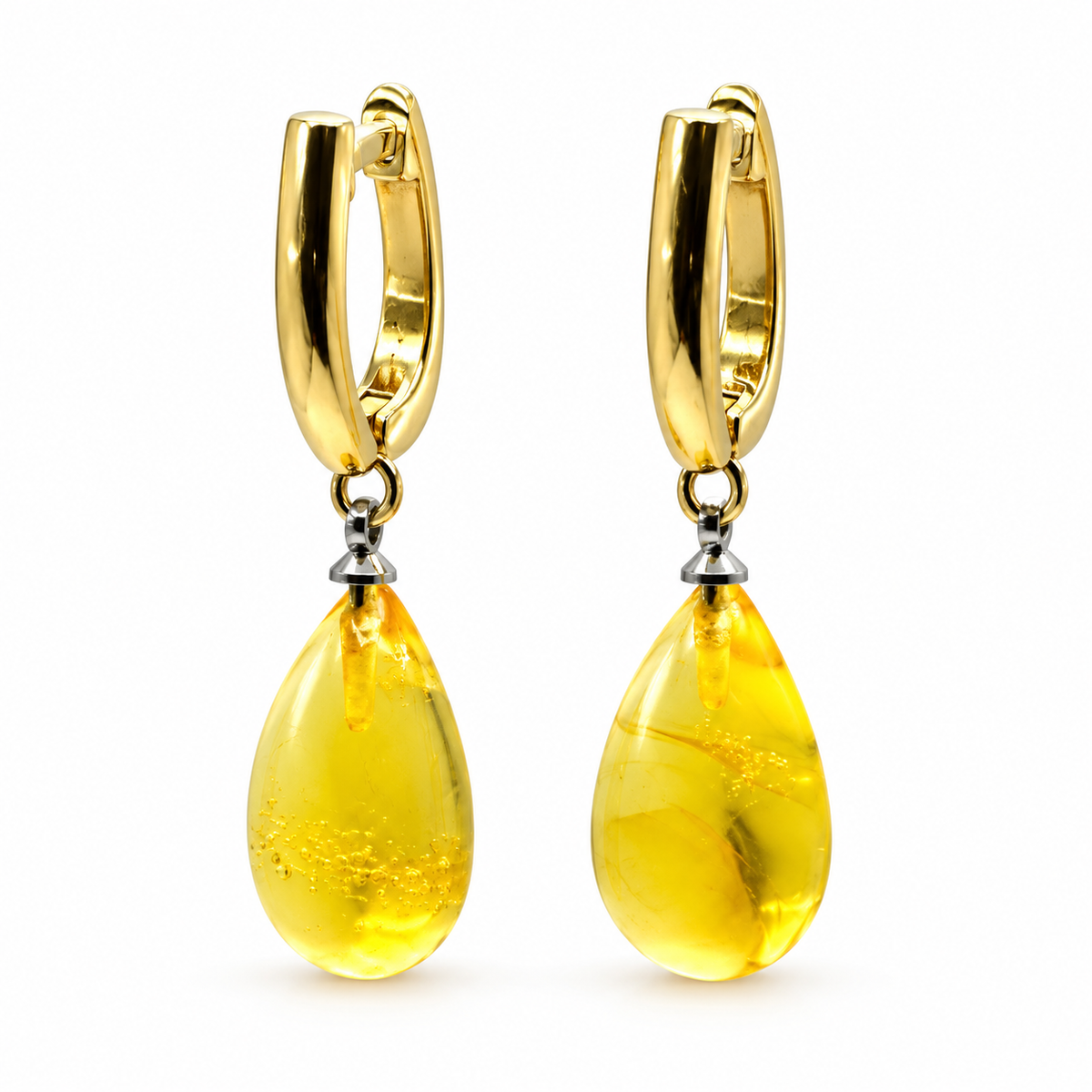 KIZIMA translucent amber teardrop pair with gold-plated oval hoops photographed against pure white.