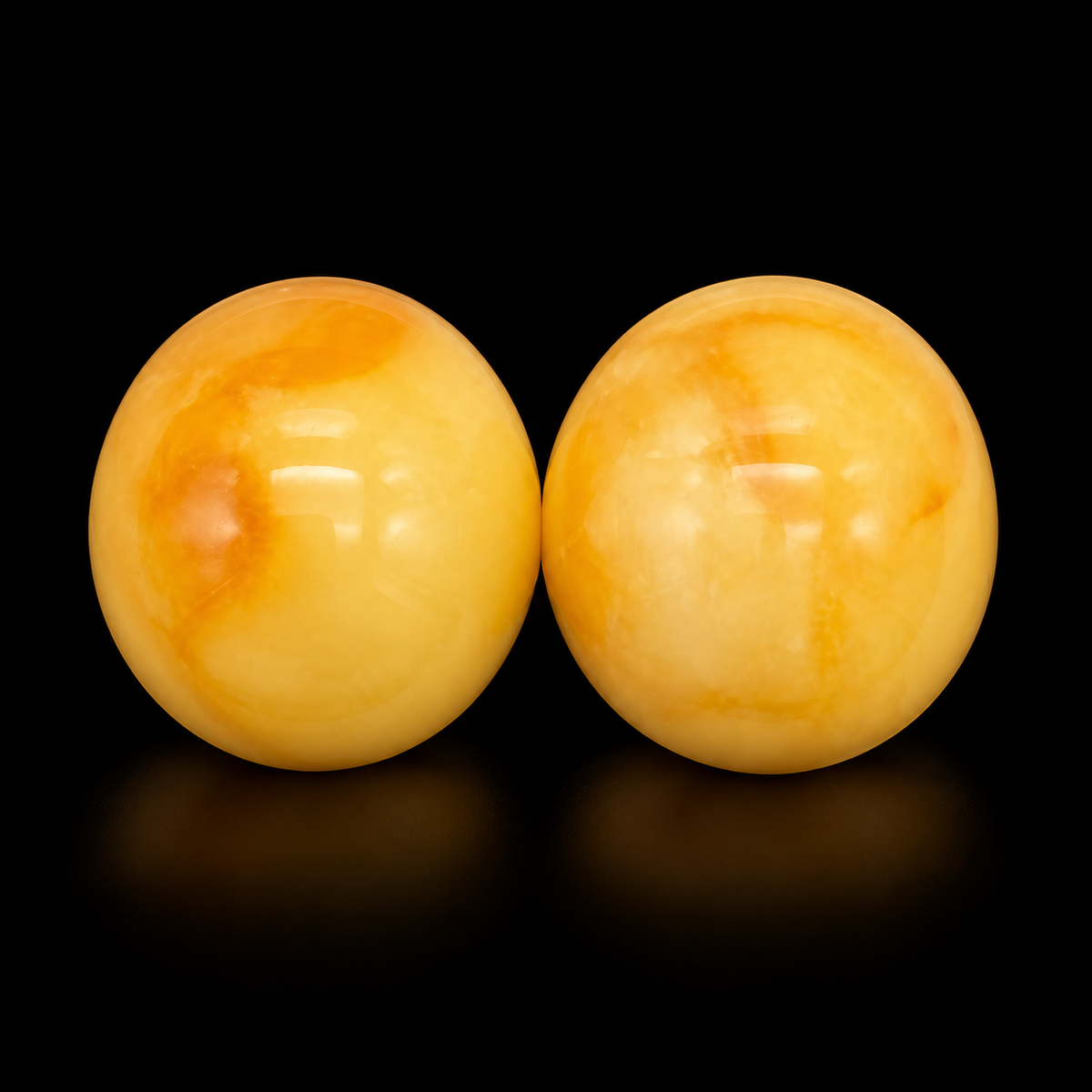 KIZIMA honey-yellow amber dome stud earring pair showing creamy natural color variation, black studio view, SKU 5N0170q0.8.