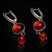 KIZIMA cognac amber earrings with round rimmed cabochons and smaller ball drops, black studio view, SKU 5N0400q4-23.