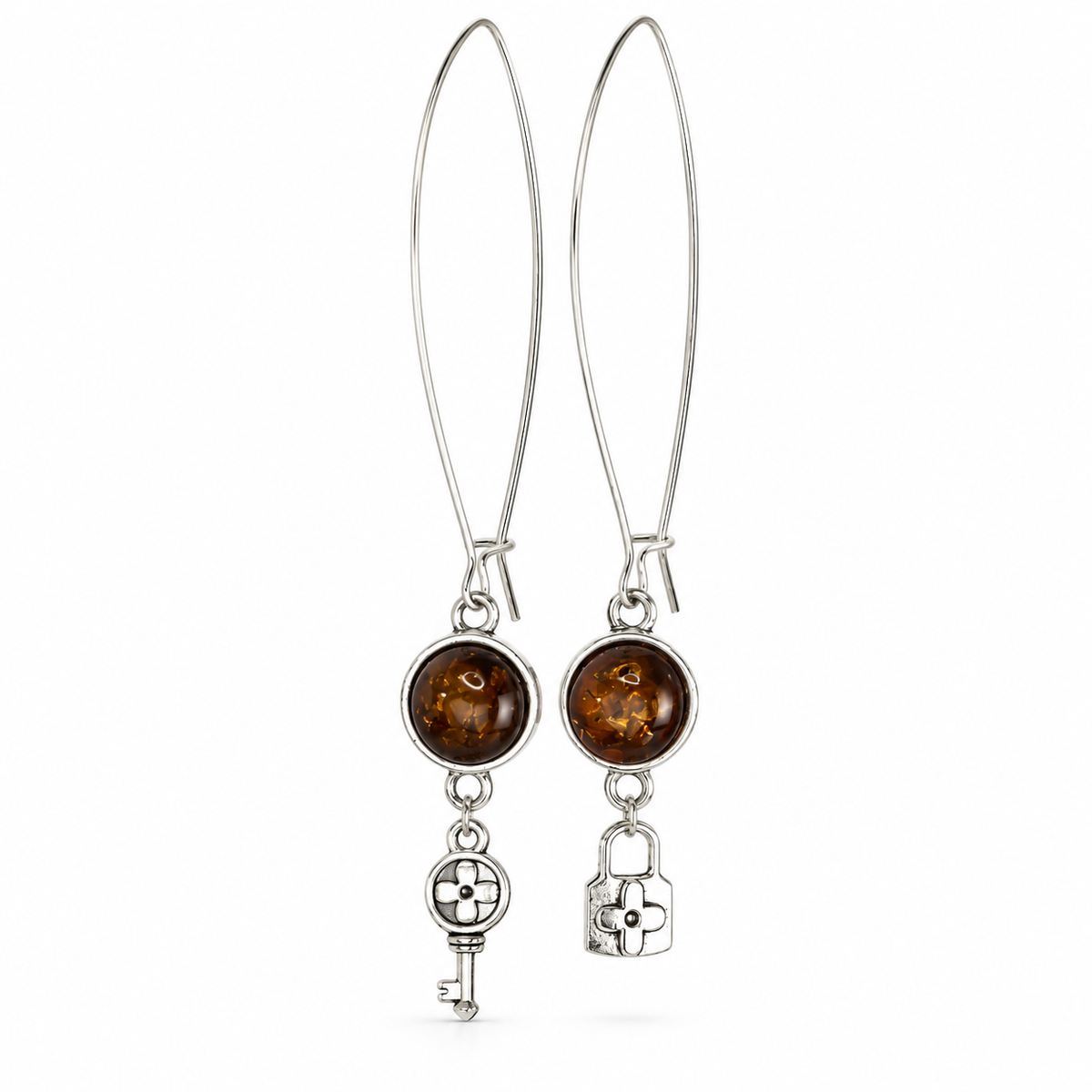KIZIMA long marquise-wire earrings with round cognac amber and floral key-lock charms on pure white.