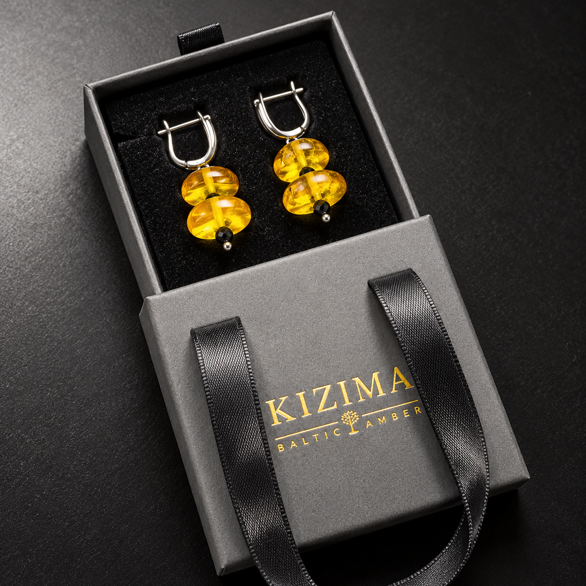 KIZIMA yellow amber double disc earrings pair in the signature charcoal gray drawer gift box with black ribbons and gold logo, SKU 5G0250q5