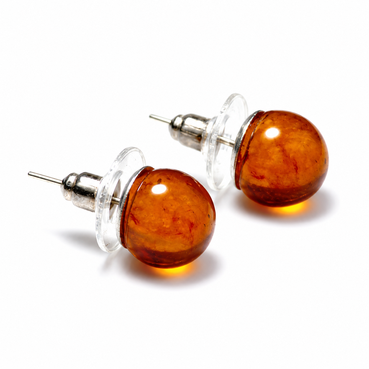 KIZIMA cognac Baltic amber stud earring pair with clear disk backs on a white background