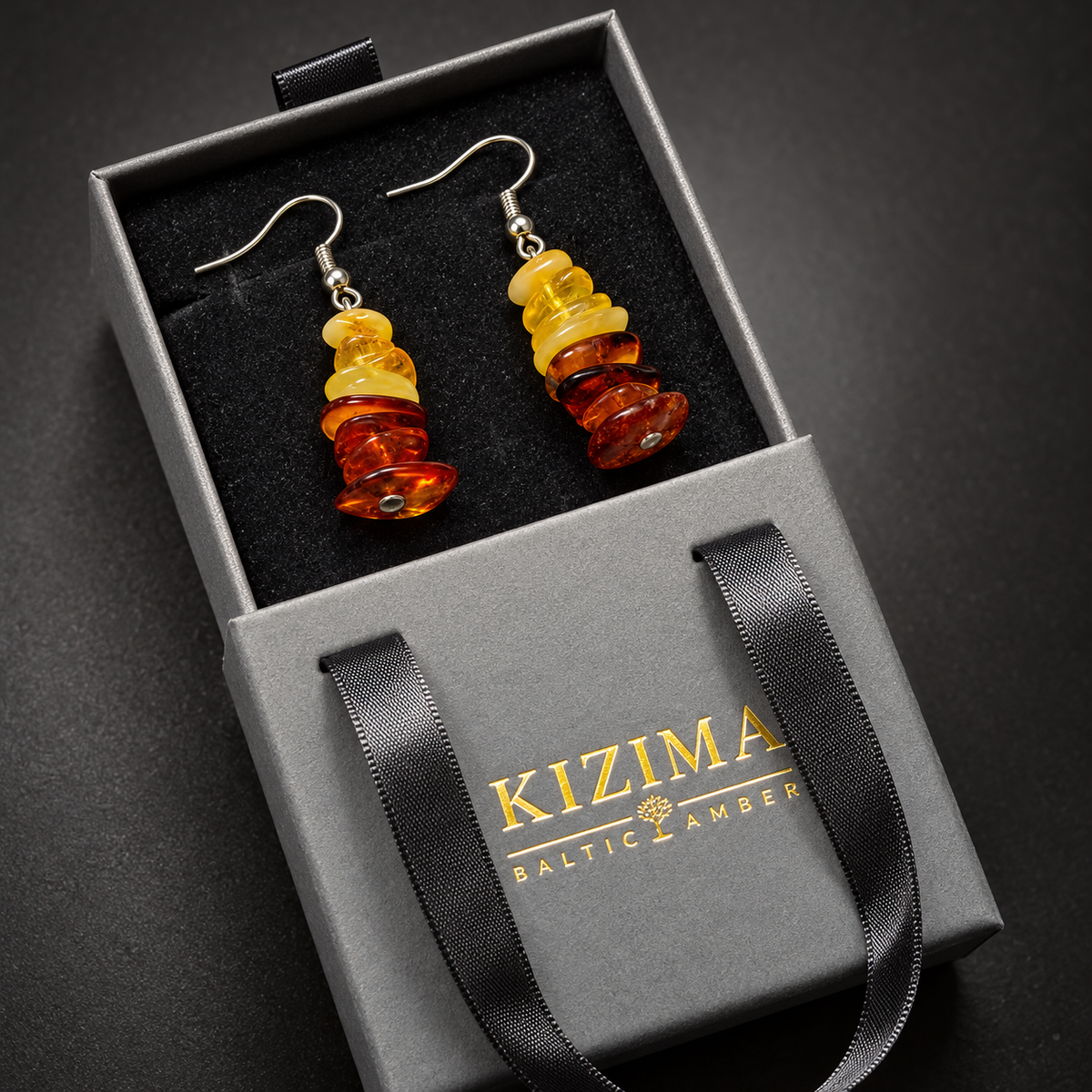 KIZIMA mixed amber chip earrings pair in the signature charcoal gray drawer gift box with black ribbons and gold logo, SKU 662987478908