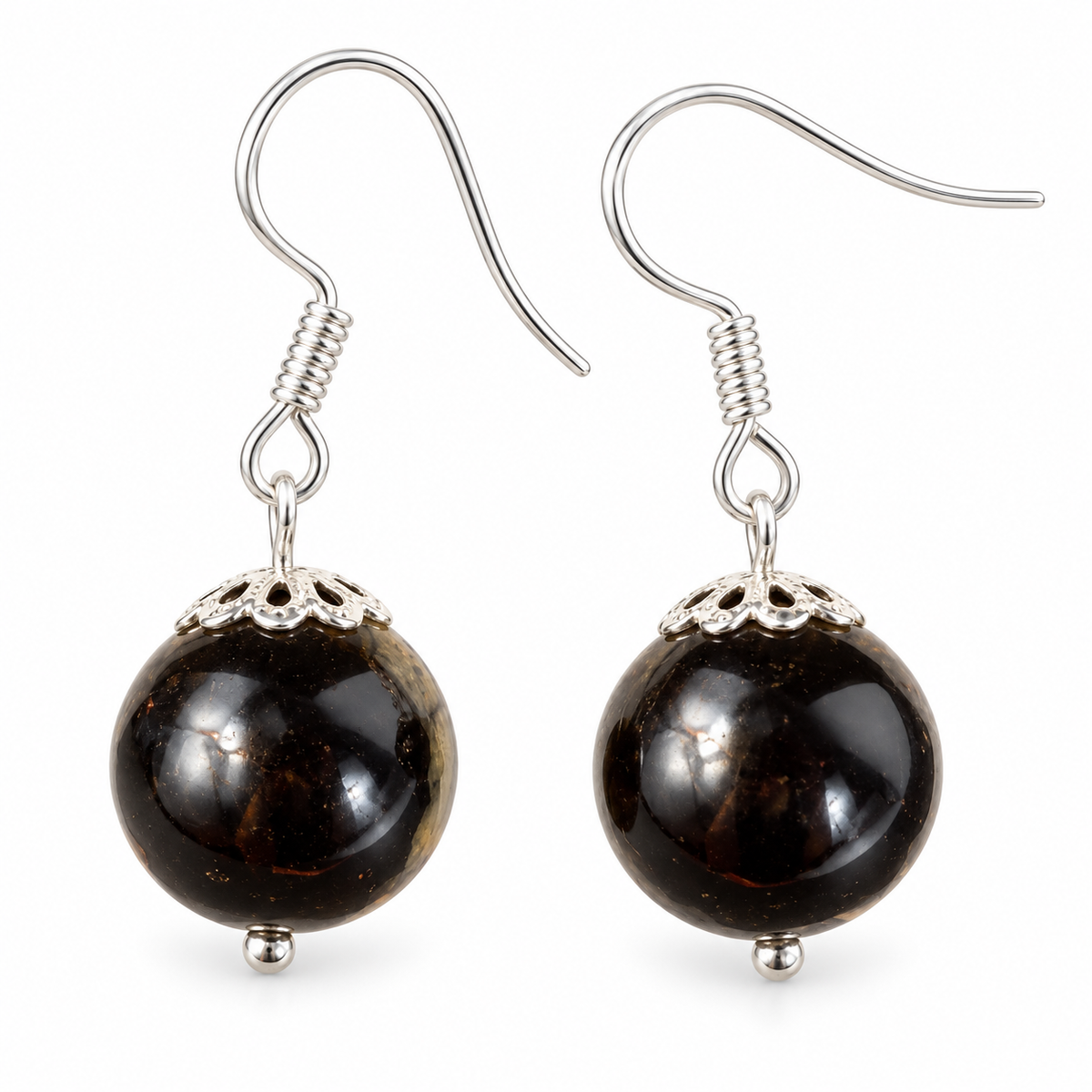 KIZIMA black Baltic amber sphere earrings with silver-tone fishhooks and filigree caps on a white background