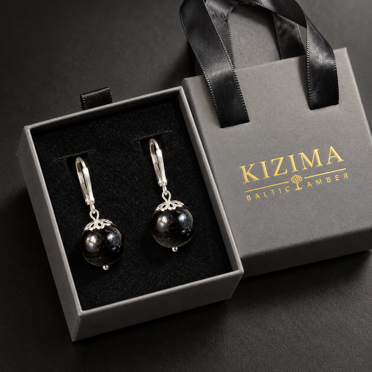 KIZIMA black amber ball earrings pair in the signature charcoal gray drawer gift box with black ribbons and gold logo, SKU 662987478922