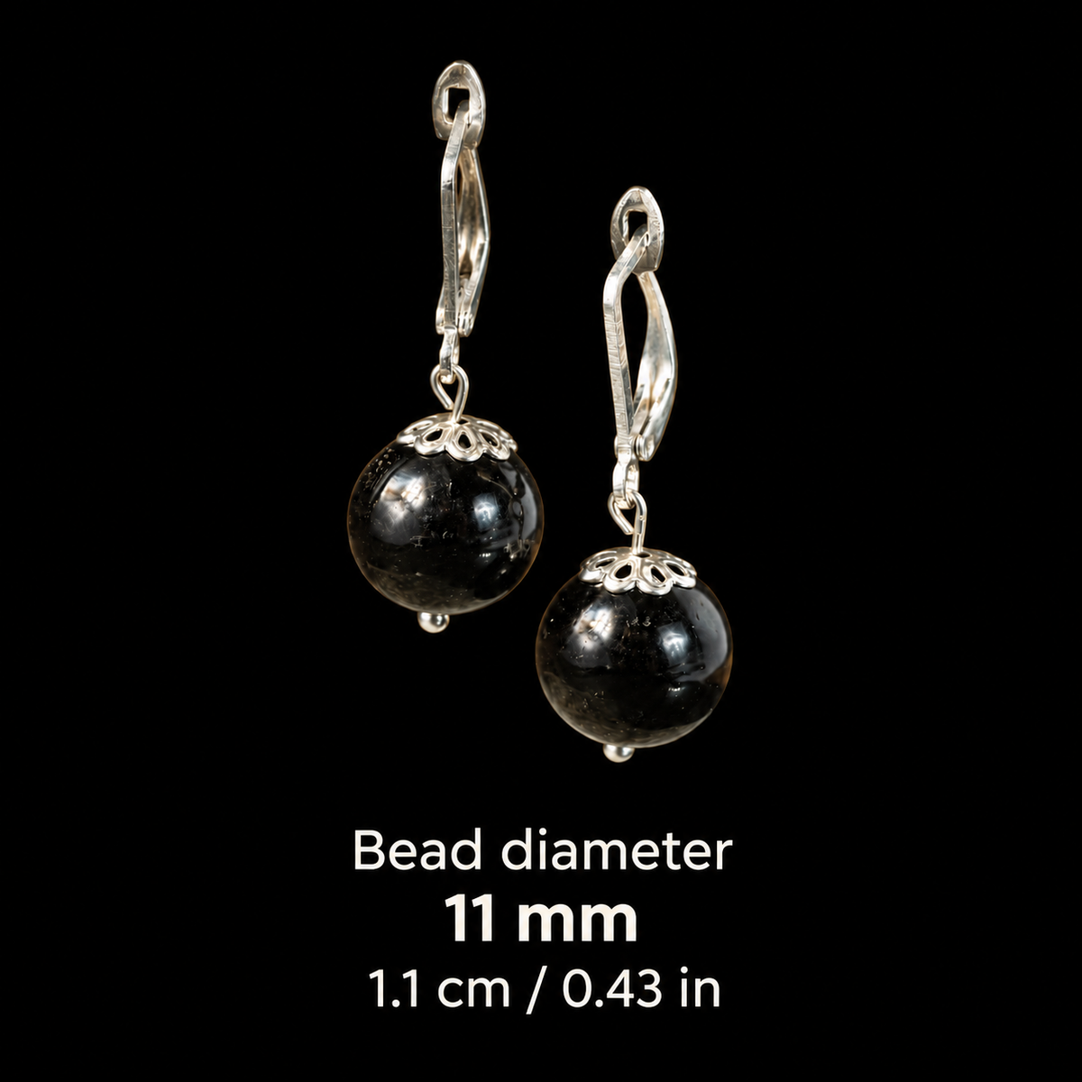 KIZIMA black amber earrings bead diameter card: 11 mm, equivalent to 1.1 cm or 0.43 in. Measurement refers only to the amber bead.