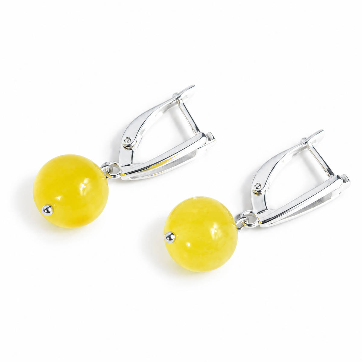 KIZIMA yellow amber ball earrings with silver-tone leverback clasps and small pin tips, pure white catalog view, SKU 662987479004.