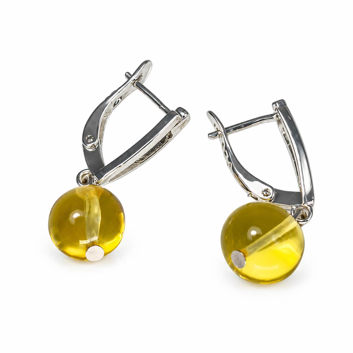 KIZIMA transparent honey-yellow amber sun ball earrings with silver-tone lock clasps, pure white catalog view, SKU 662987479011.