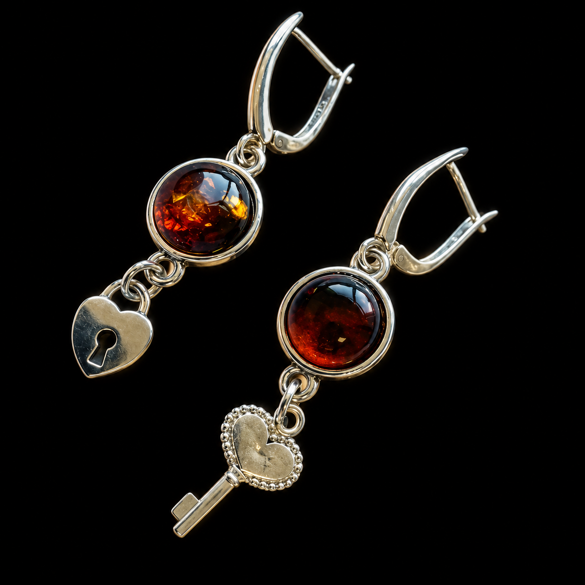 KIZIMA cognac amber asymmetric key and heart-lock earrings with silver-tone leverbacks on a black studio background