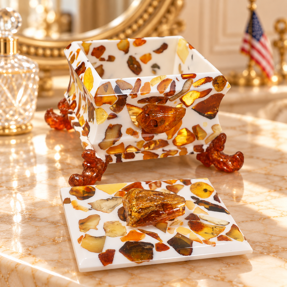 KIZIMA 8BOX3Q102-10-9-8 open Baltic amber jewelry box and removable lid on an ivory marble boudoir vanity with gold mirror