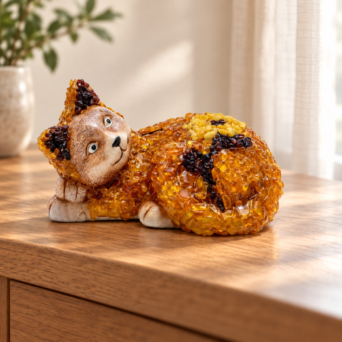 Textured amber cat money box displayed on a wooden console in a softly lit home