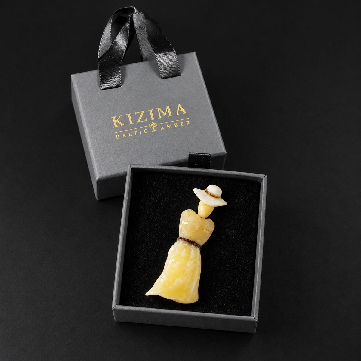 KIZIMA Baltic amber lady brooch 20S1974q6.58 in the charcoal-gray KIZIMA drawer gift box with black velvet lining and ribbon-handled outer sleeve