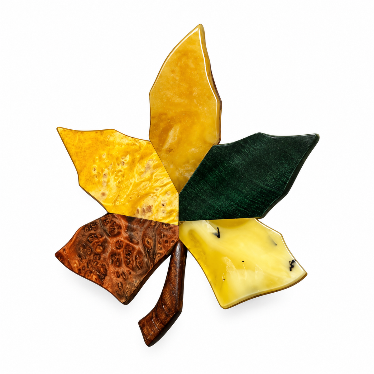 Maple leaf brooch with yellow amber and multicolored wood segments on a white background.