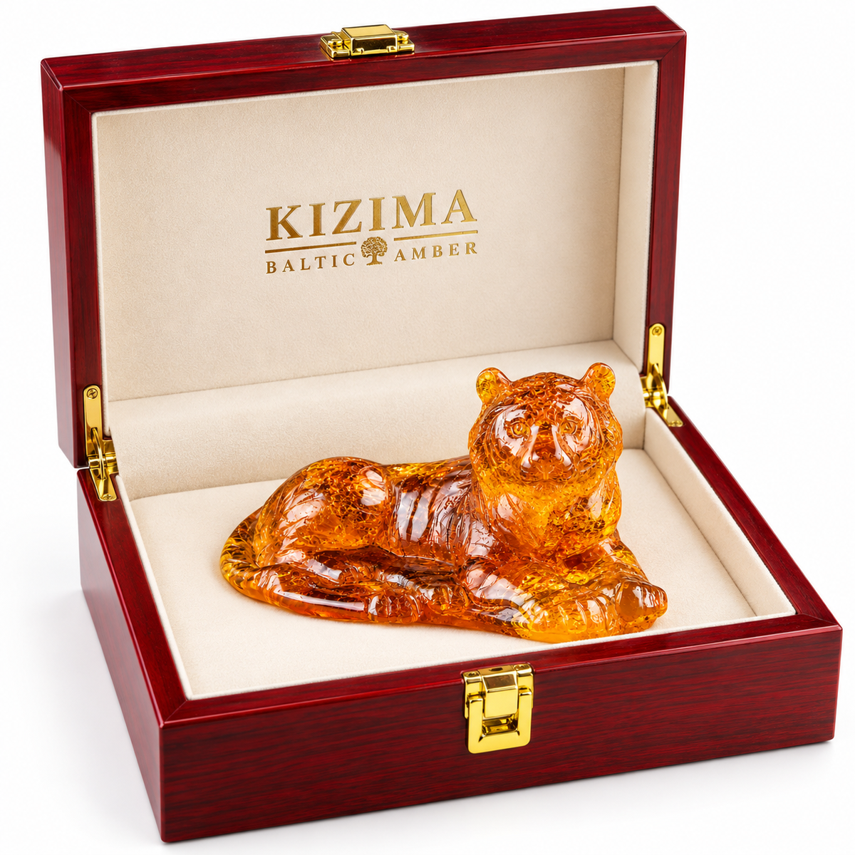 KIZIMA reclining Baltic amber tiger figurine in an open red wooden gift box with cream lining on a white background.