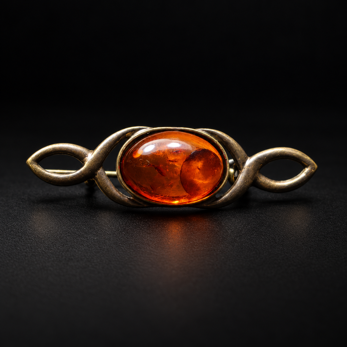 KIZIMA Baltic amber infinity bar brooch 20-903Q3-4-2-1 — black studio background