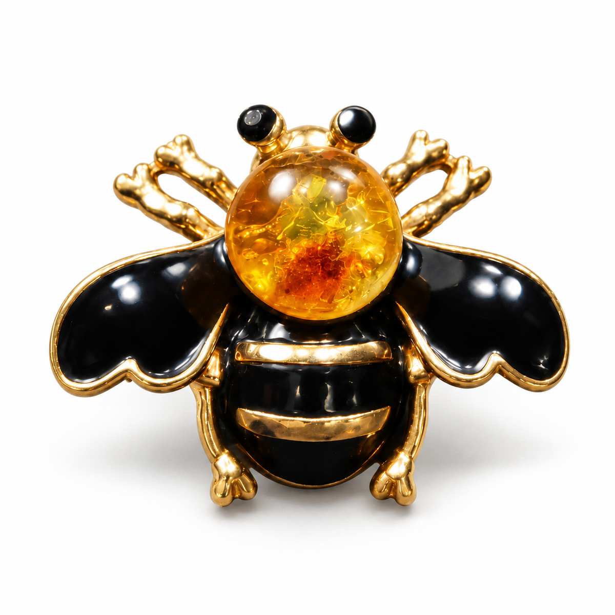 KIZIMA black enamel bee brooch 20N0120-38 with round Baltic amber on a white studio background.