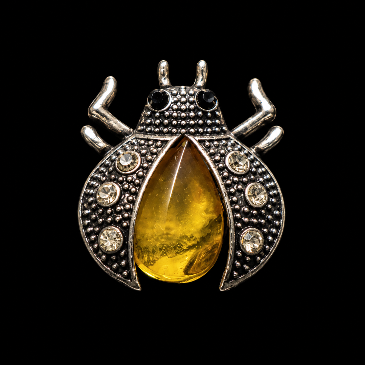 KIZIMA yellow honey amber beetle brooch 20-301Q5-2-2-1, black studio background.
