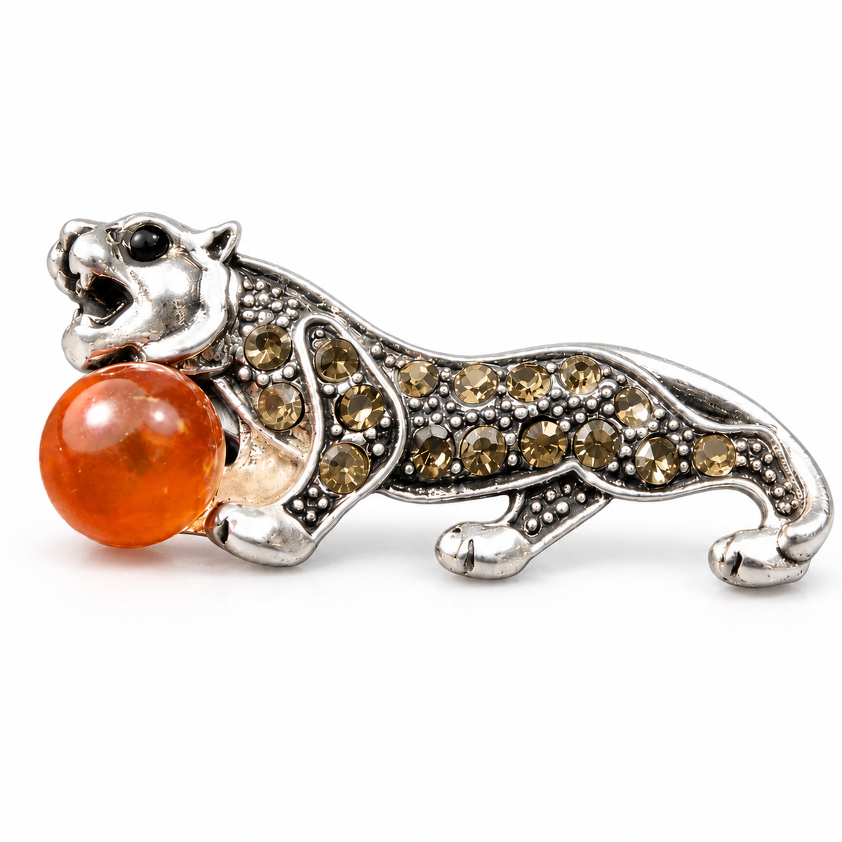 KIZIMA silver-tone tiger brooch 20N0120-20 with honey-orange Baltic amber on a white studio background.
