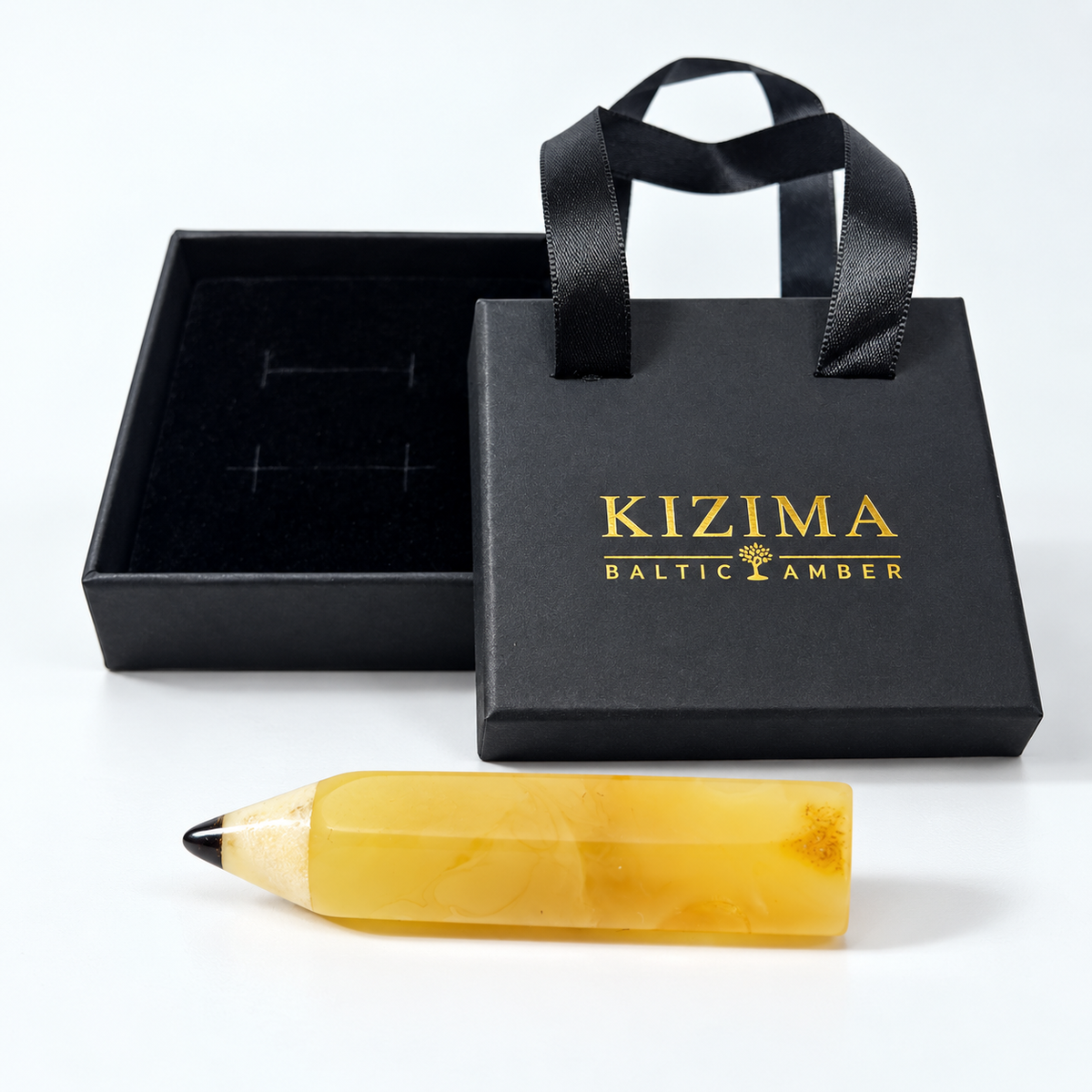 KIZIMA Baltic amber brooch 20S0702q2.34 beside authentic black KIZIMA gift packaging.
